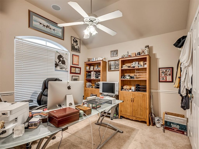 office with ceiling fan, lofted ceiling, and light colored carpet