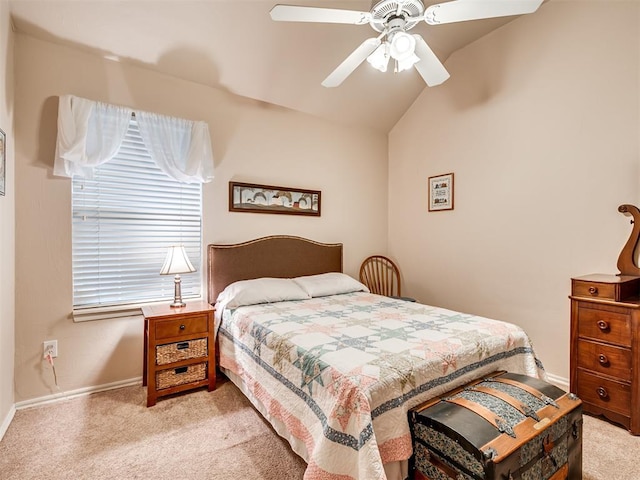 bedroom featuring light carpet, lofted ceiling, and ceiling fan