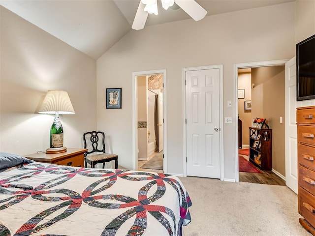 bedroom with lofted ceiling, carpet floors, ceiling fan, and ensuite bathroom