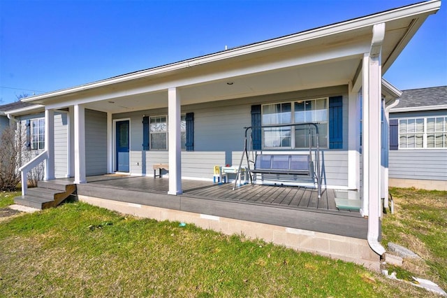 view of front of home featuring covered porch and a front yard