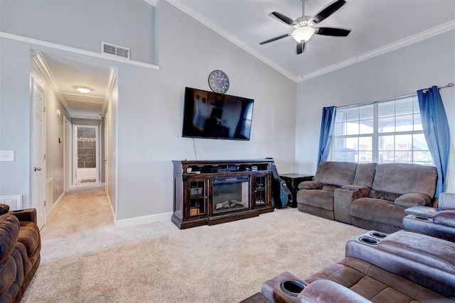 living room featuring crown molding, ceiling fan, light carpet, and vaulted ceiling