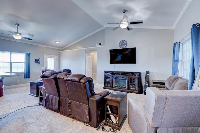 carpeted living room featuring ceiling fan, vaulted ceiling, and ornamental molding