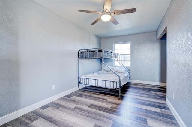 bedroom featuring wood-type flooring and ceiling fan