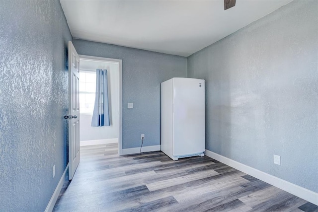 empty room with light hardwood / wood-style floors