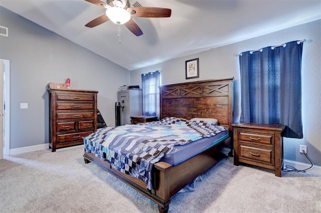 carpeted bedroom featuring ceiling fan and vaulted ceiling