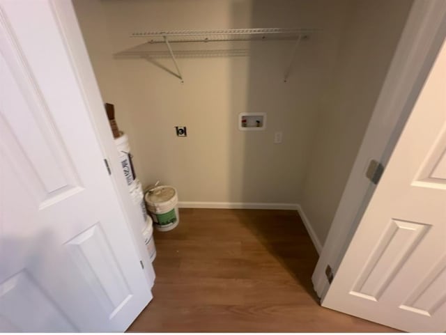 laundry area with dark hardwood / wood-style floors, electric dryer hookup, and hookup for a washing machine