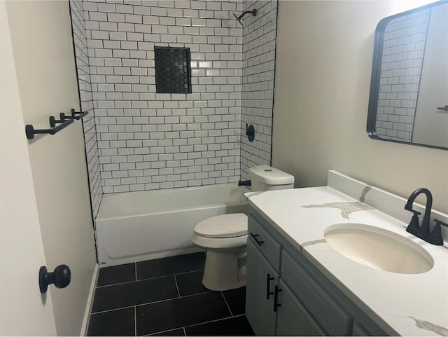 full bathroom with tiled shower / bath combo, toilet, tile patterned floors, and vanity