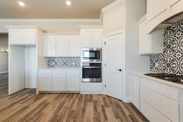 kitchen featuring light countertops, appliances with stainless steel finishes, and white cabinetry