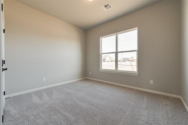 empty room featuring carpet flooring