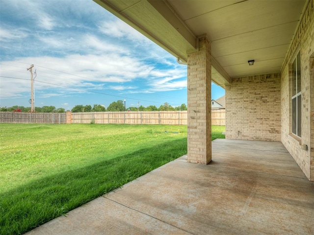 view of yard with a fenced backyard and a patio