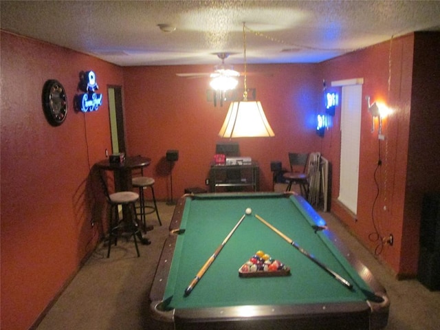 game room with ceiling fan, carpet floors, a textured ceiling, and pool table