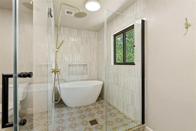 bathroom with tile walls, independent shower and bath, and tile patterned flooring