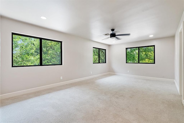 carpeted empty room with ceiling fan