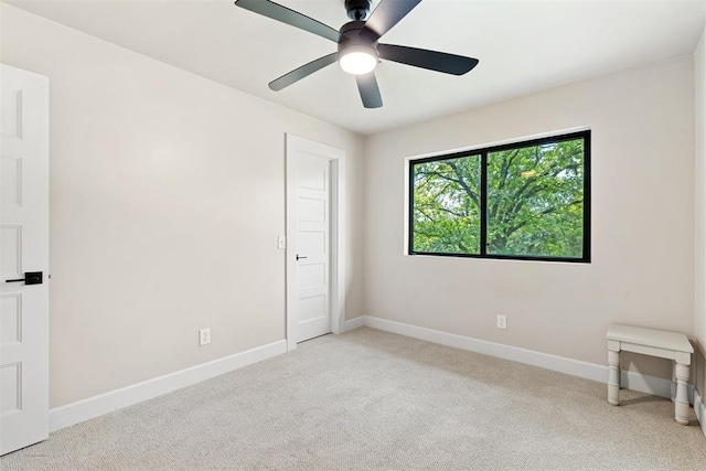 carpeted empty room with ceiling fan