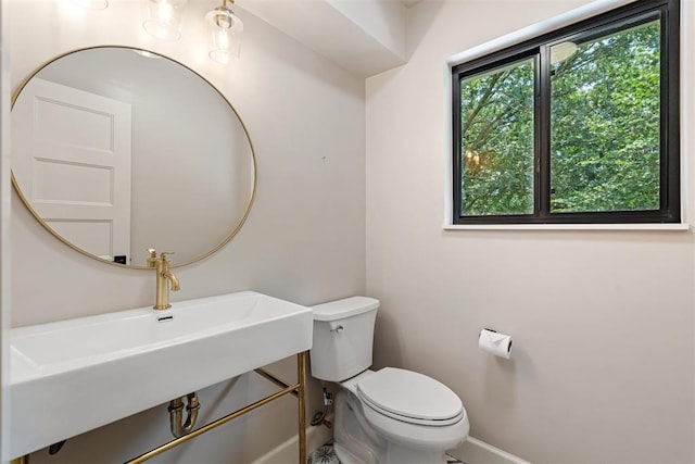 bathroom with toilet and sink