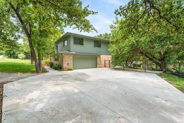 view of front property with a garage and a front yard