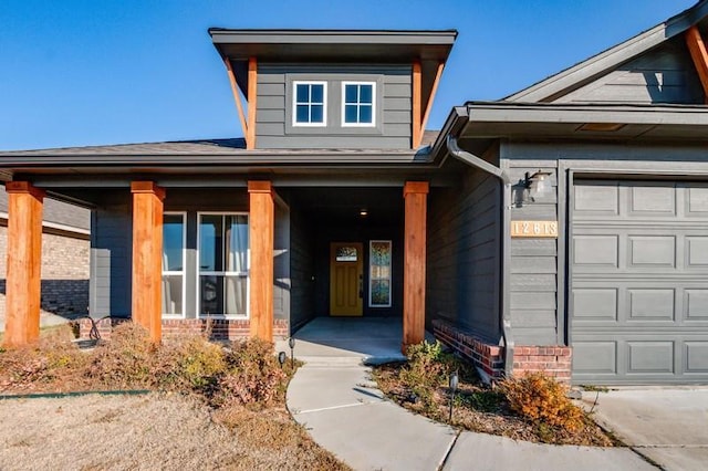 view of front of house with a porch and a garage