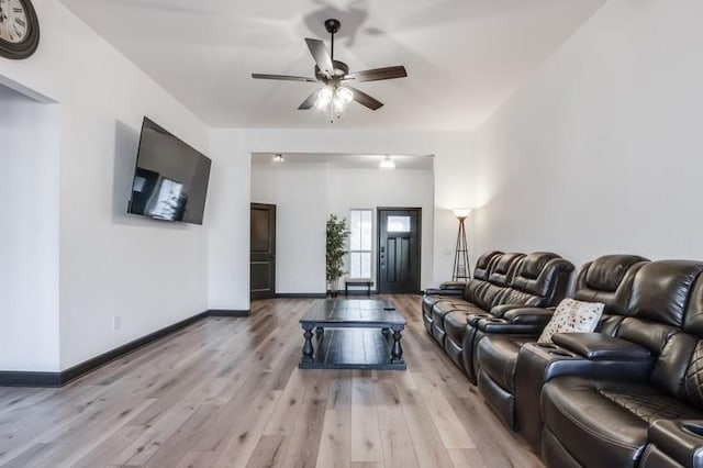 living room featuring ceiling fan and light wood-type flooring