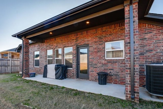 rear view of house featuring a patio area and central AC unit