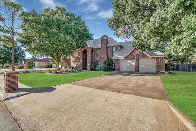 view of front facade with a garage and a front yard