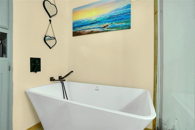 bathroom featuring sink and a bath