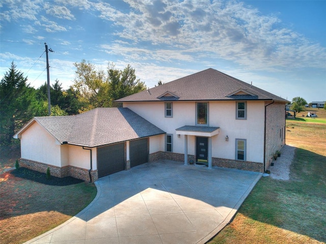 view of front of home featuring a garage and a front lawn