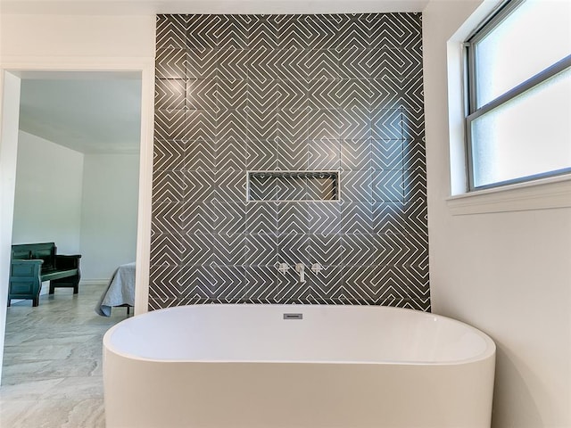 bathroom featuring a washtub