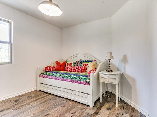 bedroom featuring wood-type flooring