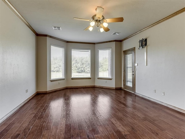 unfurnished room featuring dark hardwood / wood-style flooring, ceiling fan, and ornamental molding