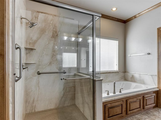 bathroom featuring separate shower and tub and crown molding