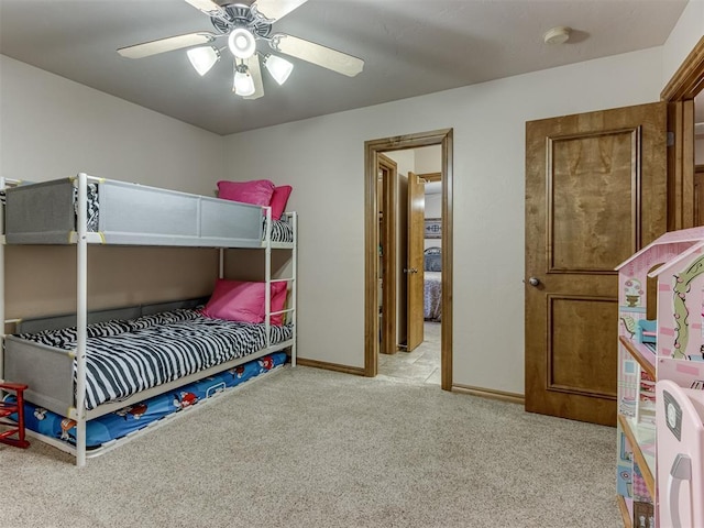 bedroom with ceiling fan and light colored carpet