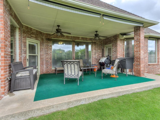 view of patio / terrace featuring ceiling fan and a grill