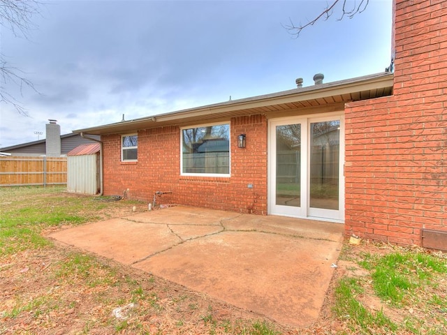 rear view of property featuring a patio area