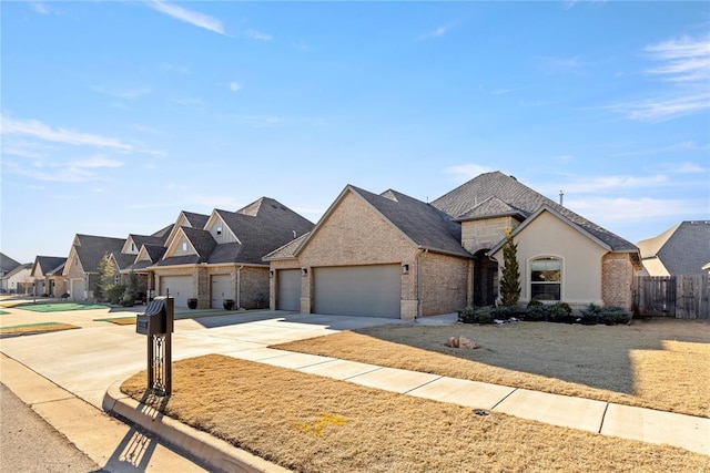 french provincial home featuring a garage