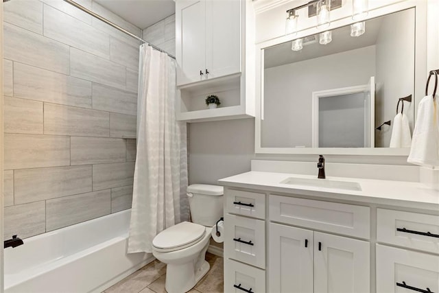 full bathroom featuring toilet, vanity, tile patterned floors, and shower / bath combo with shower curtain