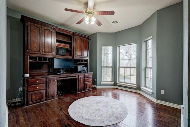 office space with ceiling fan and dark hardwood / wood-style floors