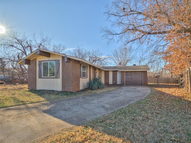 ranch-style home with a front lawn and a garage