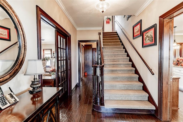 stairway featuring wood-type flooring and ornamental molding