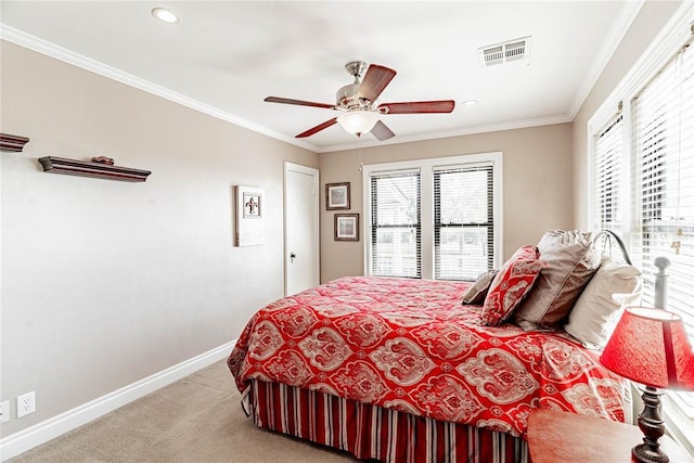 carpeted bedroom featuring ceiling fan and crown molding