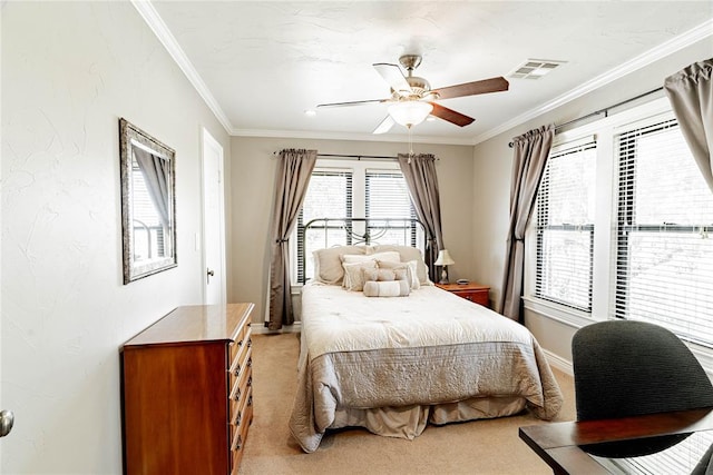 bedroom featuring ceiling fan, crown molding, and light carpet