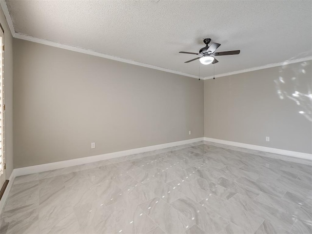 spare room featuring crown molding, baseboards, and a textured ceiling