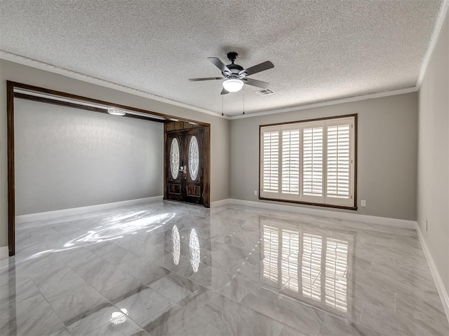 empty room featuring ceiling fan, ornamental molding, a textured ceiling, and french doors