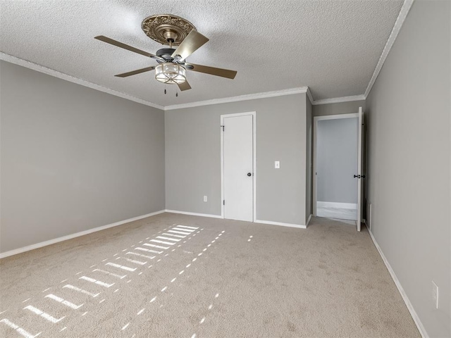 unfurnished bedroom with ceiling fan, ornamental molding, a textured ceiling, and light carpet