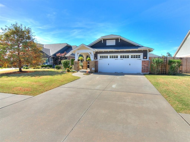 view of front of home featuring a garage and a front lawn