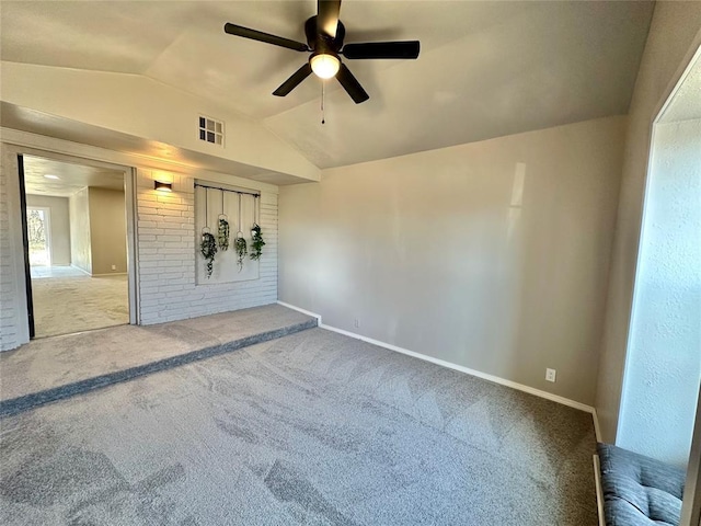 empty room with carpet flooring, ceiling fan, and lofted ceiling