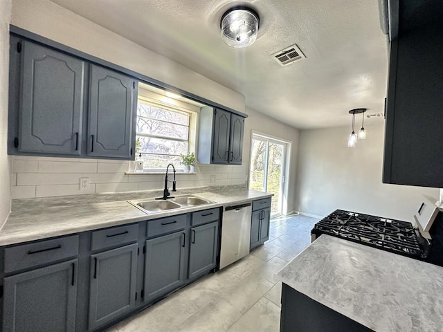 kitchen with dishwasher, decorative backsplash, decorative light fixtures, and sink