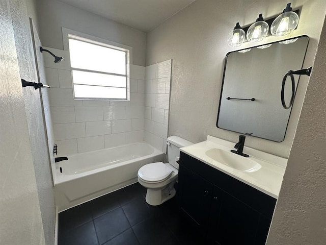 full bathroom with tile patterned flooring, vanity, toilet, and tiled shower / bath