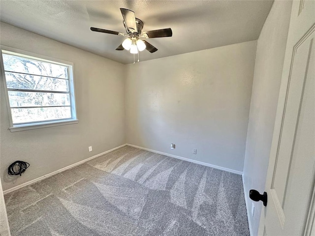 empty room with carpet and ceiling fan