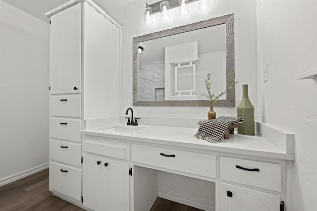 bathroom with vanity and hardwood / wood-style floors