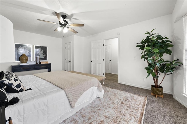 bedroom featuring ceiling fan and carpet